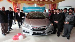 Officials of Hill View Honda, Sidhra during launch of All New 4th Generation Honda City on Tuesday. -Excelsior/Rakesh Officials of Hill View Honda, Sidhra during launch of All New 4th Generation Honda City on Tuesday. -Excelsior/Rakesh