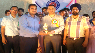 Winner of debate competition being felicitated at Polytechnic College in Jammu.