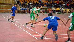 Players in action during a match of Indoor Futsal Competition 2014 in Srinagar on Monday.