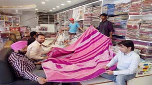 Customers at Furnishing Mall, which was opened at Gulab Singh Marg, Jammu. The Mall offers huge range of curtains, bed covers, mattresses and carpets at lowest price.