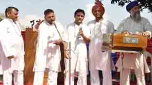Artists presenting cultural item during a programme at Kot Bhalwal Jail on Wednesday.