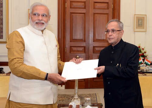 Leader of the BJP Parliamentary Party Narendra Modi handing over the letter to President Pranab Mukherjee, at Rashtrapati Bhavan in New Delhi on Tuesday. (UNI) Leader of the BJP Parliamentary Party Narendra Modi handing over the letter to President Pranab Mukherjee, at Rashtrapati Bhavan in New Delhi on Tuesday. (UNI)