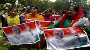 Bharatiya Janata Party (BJP) Kashmir wing celebrating party win across country in Parliamentary elections in Srinagar on Saturday. -Excelsior/Amin War Bharatiya Janata Party (BJP) Kashmir wing celebrating party win across country in Parliamentary elections in Srinagar on Saturday. -Excelsior/Amin War