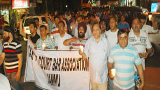 Lawyers taking out candle march in Jammu on Thursday.
