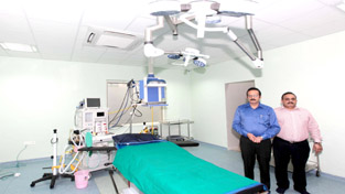 Anil Sharma and Dr Ashok Sharma showing features of modular operation theatre at SDDM Hospital and Research Centre, Channi Himmat on Sunday. -Excelsior/Rakesh Anil Sharma and Dr Ashok Sharma showing features of modular operation theatre at SDDM Hospital and Research Centre, Channi Himmat on Sunday. -Excelsior/Rakesh