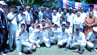 Jubilant players of District Baramulla Under-17 boys cricket team posing for a group photograph alongwith Navin Agarwal, Director General Youth Services and Sports in Srinagar. Jubilant players of District Baramulla Under-17 boys cricket team posing for a group photograph alongwith Navin Agarwal, Director General Youth Services and Sports in Srinagar.