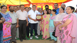 Minister for PHE, Sham Lal Sharma being presented memento during valedictory function of Inter-District Tournament.