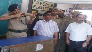 SSP Udhampur, Mohd Suleman Choudhary aiming a shoot while inaugurating Summer Camp at DPS in Udhampur.