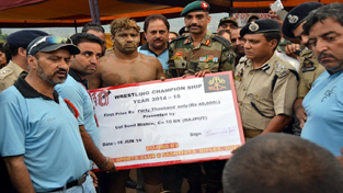 DIG Doda, Ashkoor Ahmed Wani felicitating winner during National Wrestling championship in Doda.