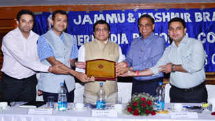 Vikram Garg, Chairman J&K Branch of ICAI alongwith his team presenting a memento to A.K.Thathai, Commissioner of Income Tax (J&K).