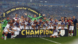 Germany’s players posing for a photograph while celebrating World Cup victory against Argentina. Germany’s players posing for a photograph while celebrating World Cup victory against Argentina.
