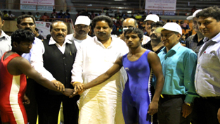 Minister for Sports, Raman Bhalla felicitating winners during National Wrestling Championship in Srinagar on Wednesday.
