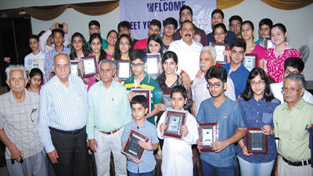 Union Minister, Dr Jitendra Singh giving awards to meritorious students of class 10th and 12th from displaced Kashmiri Pandit community at a function organized at New Delhi. Union Minister, Dr Jitendra Singh giving awards to meritorious students of class 10th and 12th from displaced Kashmiri Pandit community at a function organized at New Delhi.