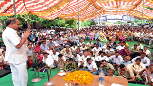 Deputy Chief Minister Tara Chand addressing public gathering at Khour on Monday.