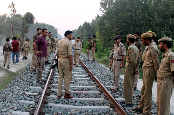 Security personnel inspecting the spot on a railway track at Malangpora, Awantipora in Pulwama after militants attack on a police constable. —Excelsior/ Younis Khaliq Security personnel inspecting the spot on a railway track at Malangpora, Awantipora in Pulwama after militants attack on a police constable. —Excelsior/ Younis Khaliq