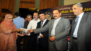 Dr Jitendra Singh, Minister in Prime Minister’s Office giving bank accounts details to the account holders during the launch of the Pradhan Mantri Jan Dhan Yojana scheme at SKICC in Srinagar on Thursday. —Excelsior/Amin War Dr Jitendra Singh, Minister in Prime Minister’s Office giving bank accounts details to the account holders during the launch of the Pradhan Mantri Jan Dhan Yojana scheme at SKICC in Srinagar on Thursday. —Excelsior/Amin War
