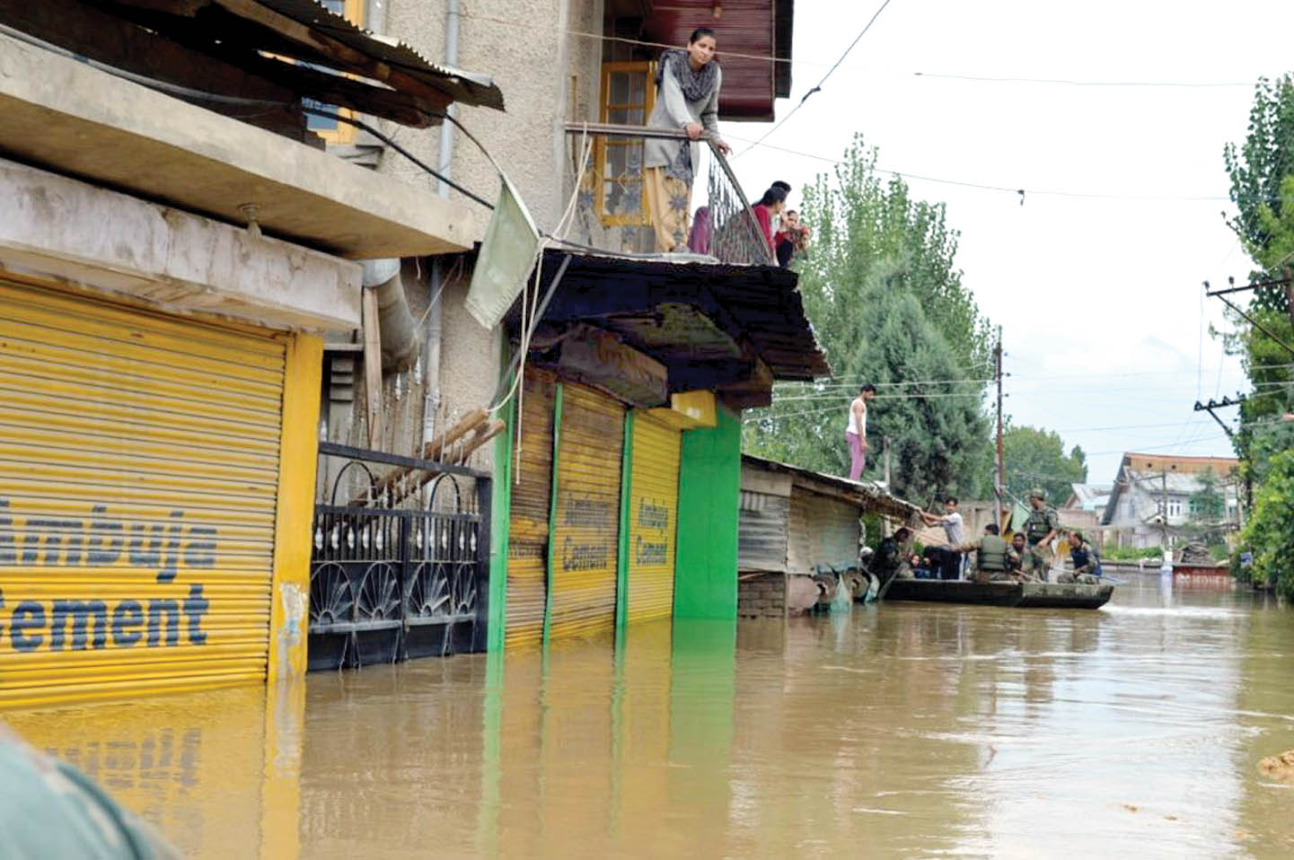 Army jawans rescue people in a boat in Srinagar on Sunday. (UNI)