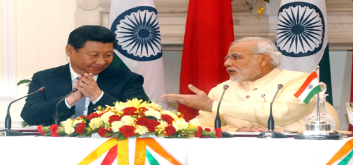 Chinese President Xi Jinping and Prime Minister Narendra Modi at a joint press conference after a bilateral discussion at Hyderabad House in New Delhi on Thursday. (UNI)