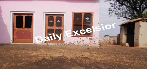 Marks of shelling on a building in a Samba village on Wednesday. Excelsior/Gautam