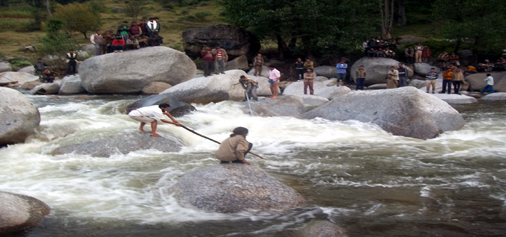 Villagers and police searching for bodies of woman and her minor son who drowned in Tawi river at Latti on Wednesday.