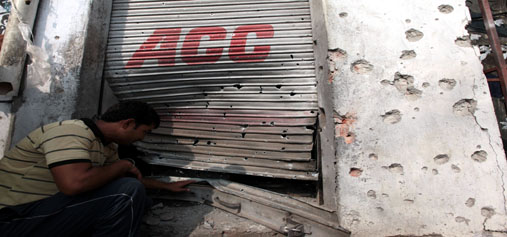 A shop hit by mortar shells in Arnia town. —Excelsior/Rakesh