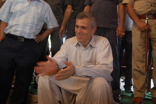 Chief Minister Omar Abdullah sitting with border migrants in a relief camp at Samba on Thursday. —Excelsior/Gautam