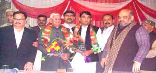 BJP president Amit Shah and other party leaders with Govind Ram Sharma who joined the party at Jammu on Wednesday.