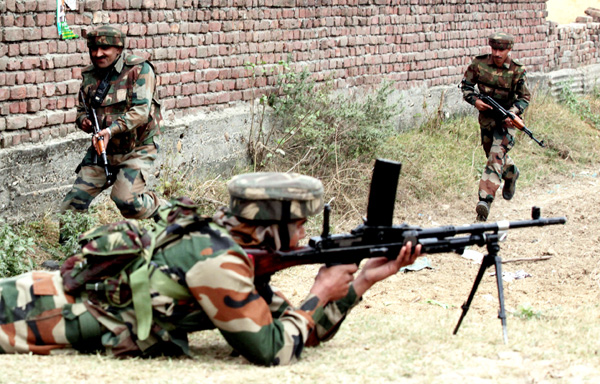 Army soldiers aim the militant at village Kathaar in Arnia Sector on Thursday. -Excelsior/Rakesh