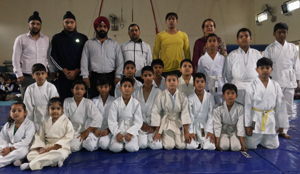 Judokas posing for a group photograph along with the chief guest and other dignitaries in Jammu on Friday. Judokas posing for a group photograph along with the chief guest and other dignitaries in Jammu on Friday.