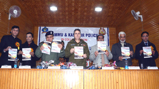Inspector General of Police Kashmir Zone Abdul Gani Mir along with others releasing souvenir during a function at Srinagar on Saturday. -Excelsior/Amin War Inspector General of Police Kashmir Zone Abdul Gani Mir along with others releasing souvenir during a function at Srinagar on Saturday. -Excelsior/Amin War