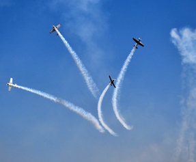 Russian aerobatic team performing during the inaugural ceremony at Yelahanka air base near Bengaluru on Wednesday. (UNI)