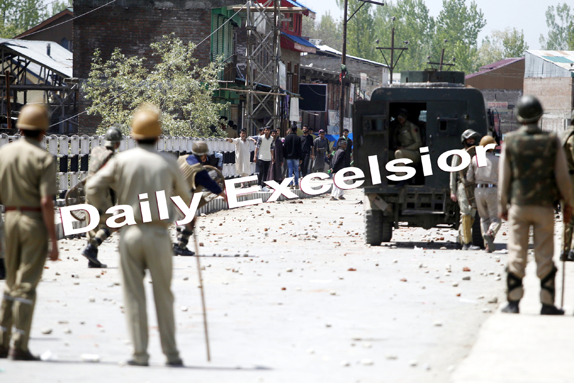 Kashmiri Muslim protesters throw stones at Police during a protest against the killing of a 16- year-old Suhail Ahmad who was killed in Police firing during a protest in Narbal area of Central kashmir’s Budgam -Photo/ Mohd Amin War