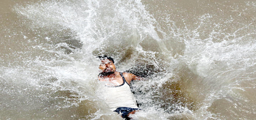 Cool bath to beat the heat... -Excelsior/Rakesh