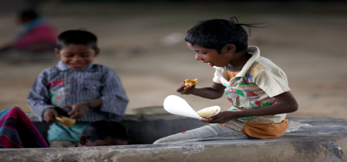 Under the shade of Flyover, a child takes food as mercury soars in Jammu on Wednesday. -Excelsior/Rakesh