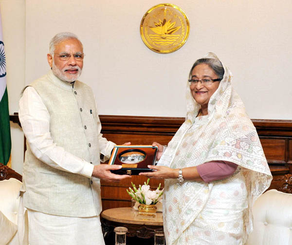 Prime Minister Narendra Modi presents to the Prime Minister of Bangladesh, Ms. Sheikh Hasina, DVD of Parliamentary debates on LBA, in Dhaka, Bangladesh on Saturday. Prime Minister Narendra Modi presents to the Prime Minister of Bangladesh, Ms. Sheikh Hasina, DVD of Parliamentary debates on LBA, in Dhaka, Bangladesh on Saturday.