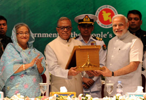 Prime Minister, Narendra Modi being received the Award of Bangladesh Liberation War Honour on behalf of former Prime Minister, Atal Bihari Vajpayee, in Dhaka, Bangladesh on Sunday. Prime Minister, Narendra Modi being received the Award of Bangladesh Liberation War Honour on behalf of former Prime Minister, Atal Bihari Vajpayee, in Dhaka, Bangladesh on Sunday.
