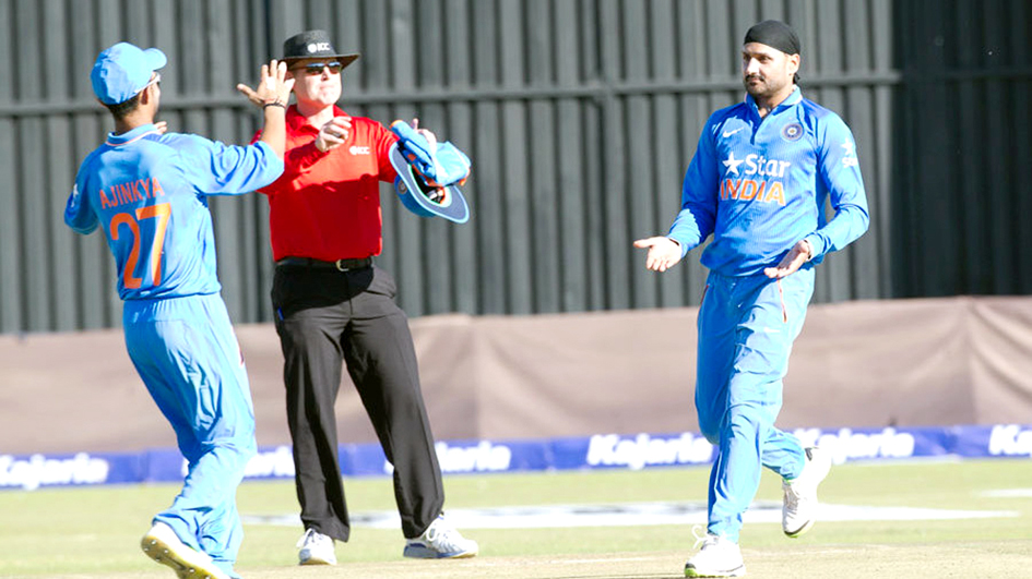 Harbhajan Singh and Axar Patel celebrating picking wickets between them during first T20 International against Zimbabwe at Harare on Friday. Harbhajan Singh and Axar Patel celebrating picking wickets between them during first T20 International against Zimbabwe at Harare on Friday.