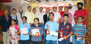 Winners posing for a group photograph alongwith chief guest and other dignitaries during concluding function of Sub Junior National Chess C’ship in Jammu on Tuesday. Winners posing for a group photograph alongwith chief guest and other dignitaries during concluding function of Sub Junior National Chess C’ship in Jammu on Tuesday.