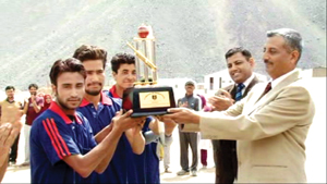 Winners of Kumbothang Cricket Premiers League being presented trophy by the chief guest in Kargil on Tuesday. Winners of Kumbothang Cricket Premiers League being presented trophy by the chief guest in Kargil on Tuesday.