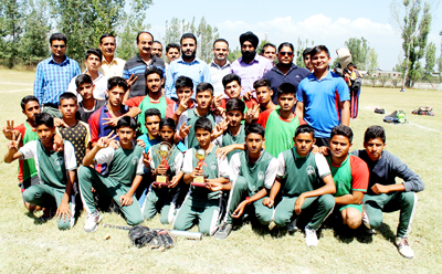 Winners of Softball Championship posing for a group photograph along with the dignitaries at Pulwama on Wednesday. Winners of Softball Championship posing for a group photograph along with the dignitaries at Pulwama on Wednesday.