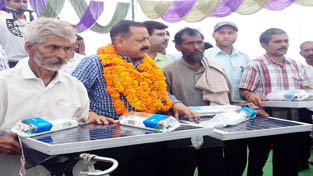 Union Minister and MP from Udhampur-Doda-Kathua Dr Jitendra Singh distributing solar lights among the flood affected people of Saddal-Panjar in district Udhampur on Saturday. Union Minister and MP from Udhampur-Doda-Kathua Dr Jitendra Singh distributing solar lights among the flood affected people of Saddal-Panjar in district Udhampur on Saturday.