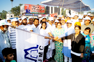 Deputy Chief Minister Dr Nirmal Singh flagging off Clean Jammu, Green Jammu Marathon on Friday. Deputy Chief Minister Dr Nirmal Singh flagging off Clean Jammu, Green Jammu Marathon on Friday.