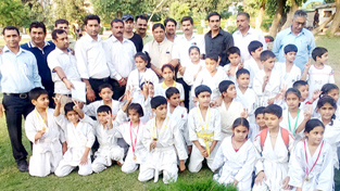 Winners of Jammu District Judo Championship posing for a group photograph alongwith chief guest MLA Sat Sharma in Jammu on Wednesday. -Excelsior/Rakesh Winners of Jammu District Judo Championship posing for a group photograph alongwith chief guest MLA Sat Sharma in Jammu on Wednesday. -Excelsior/Rakesh