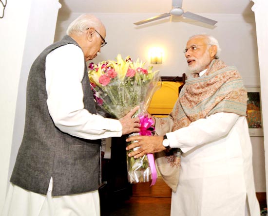 Prime Minister Narendra Modi greeting senior BJP leader L K Advani (L) on his birthday, in New Delhi on Sunday. (UNI) Prime Minister Narendra Modi greeting senior BJP leader L K Advani (L) on his birthday, in New Delhi on Sunday. (UNI)