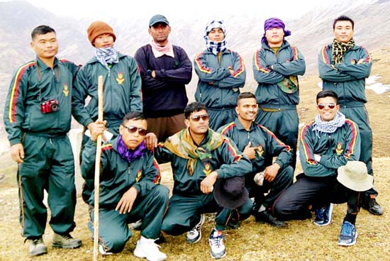 Participants of trekking expedition to Roopkund posing for a group photograph during flag in ceremony. Participants of trekking expedition to Roopkund posing for a group photograph during flag in ceremony.