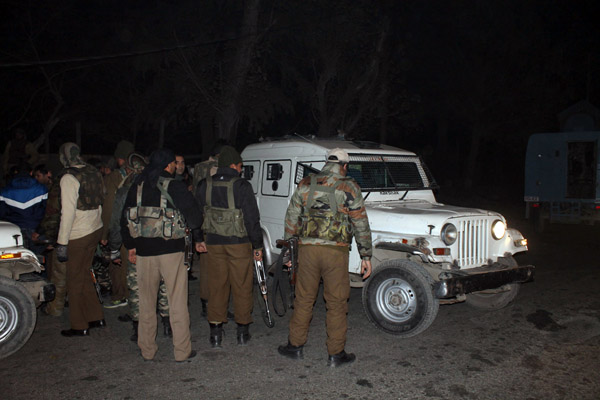 Security personnel guard the site of encounter at Pampore on Tuesday. —Excelsior/Younis Khaliq Security personnel guard the site of encounter at Pampore on Tuesday. —Excelsior/Younis Khaliq
