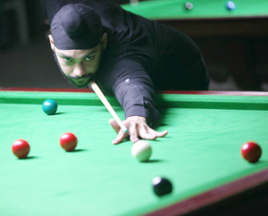 Cueist aiming a shot during a match of State Snooker & Billiards Championship at Billiards Hall, MA Stadium in Jammu. Cueist aiming a shot during a match of State Snooker & Billiards Championship at Billiards Hall, MA Stadium in Jammu.