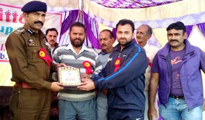 Chief guest Mohan Lal, SSP Traffic Jammu being presented memento by the organizers during opening ceremony of Bawa Jitto Kabaddi Gold Cup at Sari in Jammu. Chief guest Mohan Lal, SSP Traffic Jammu being presented memento by the organizers during opening ceremony of Bawa Jitto Kabaddi Gold Cup at Sari in Jammu.
