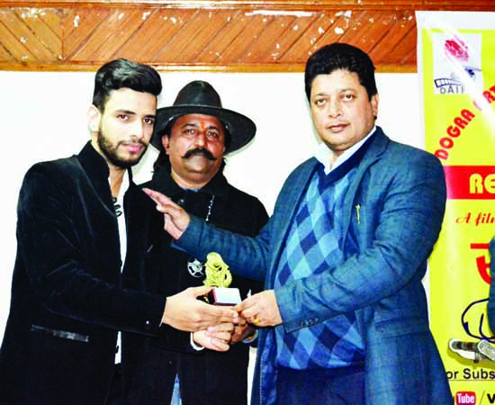 MLA Jammu East, Rajesh Gupta presenting memento to a budding actor Masood Malik during release of 'Saavdhan Jammu '. MLA Jammu East, Rajesh Gupta presenting memento to a budding actor Masood Malik during release of 'Saavdhan Jammu '.