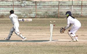 Batswoman while attempting a big heave is clean bowled in a match of Under-17 Girls National School Games at MA Stadium in Jammu on Monday. —Excelsior/Rakesh Batswoman while attempting a big heave is clean bowled in a match of Under-17 Girls National School Games at MA Stadium in Jammu on Monday. —Excelsior/Rakesh